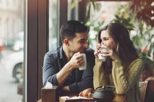 Couple in love drinking coffee in coffee shop